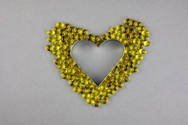 vitamin d3 supplements arranged into a heart shape